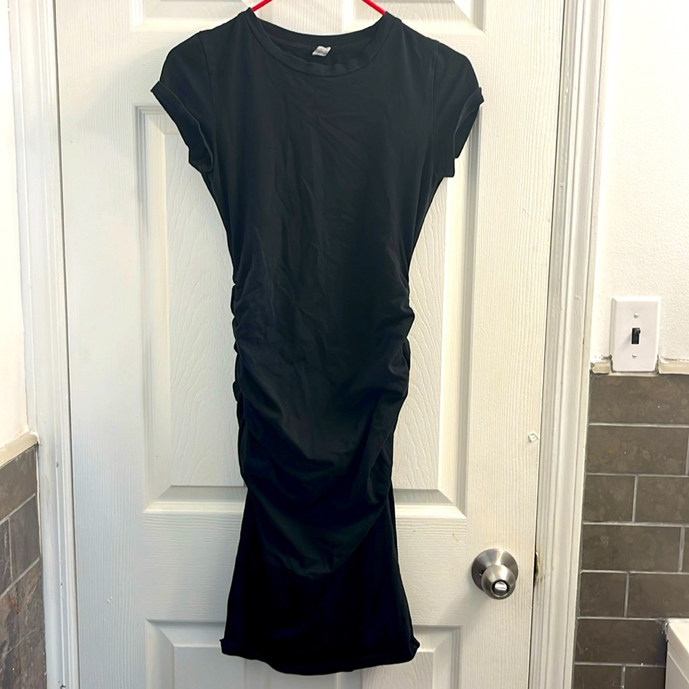 Medium size touched black dress comes down to the knee cute sneaker dress